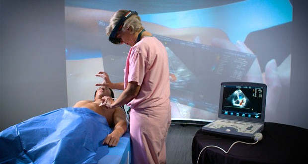 Dr. Sarah Murthi tests an augmented reality prototype that overlays ultrasound imaging data directly on the patient. This allows constant visual contact with the patient and imaging sensor, as opposed to repeatedly looking away toward a monitor. (Photo courtesy of Maryland Blended Reality Center)